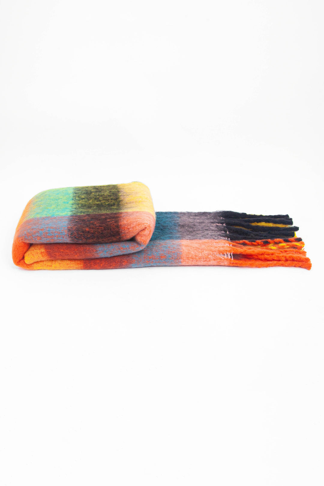 side view of the scarf when folder, showing the texture and thickness of the material. this scarf is warm and winter weight