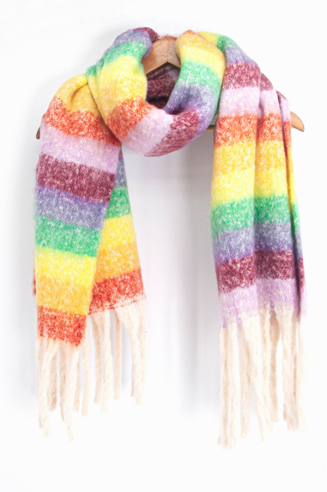 showing the multicoloured rainbow stripe winter scarf draped around a coat hanger, showing how it would look when worn.