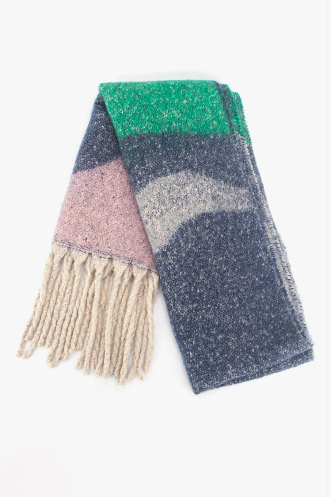 showing the scarf folded while laying flat, the multi colour wave pattern is highlighted. there are pink, navy blue and green tones visible in the design.