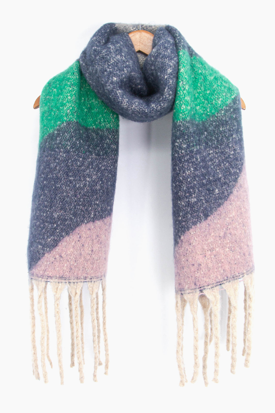 showing the navy blue, green and pink wave pattern winter scarf draped around a coat hanger, showing how it would look when worn.