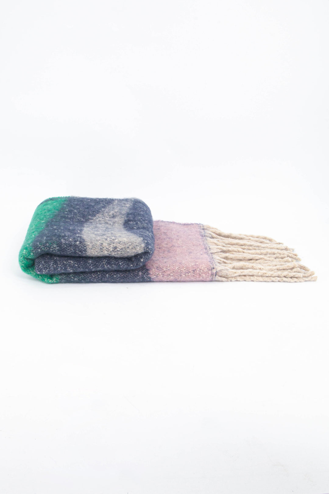 side view of the scarf when folder, showing the texture and thickness of the material. this scarf is warm and winter weight