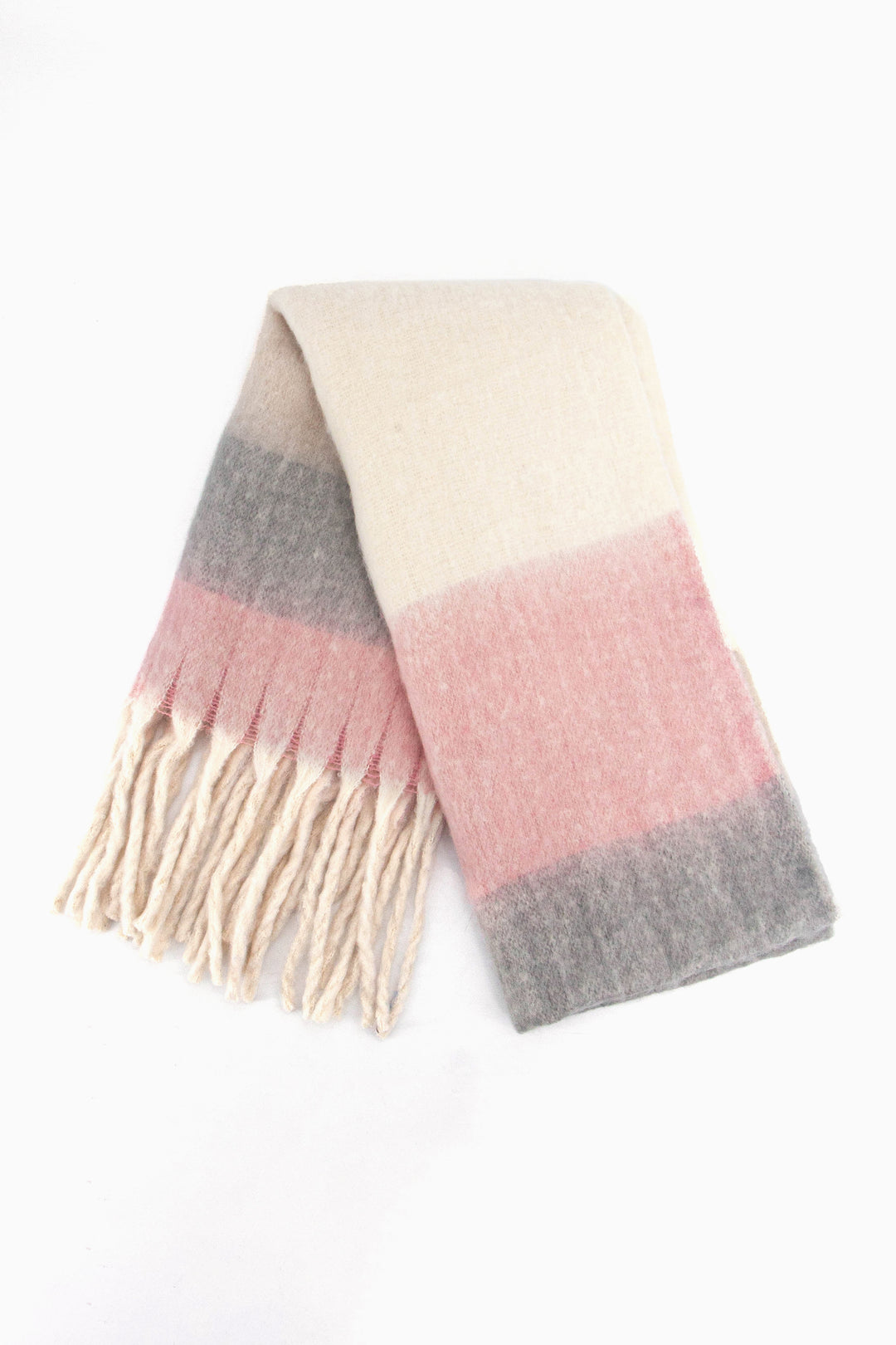showing the scarf folded while laying flat, the pink, cream and grey colour block design is clearly shown as is the cream tasselled fringe.