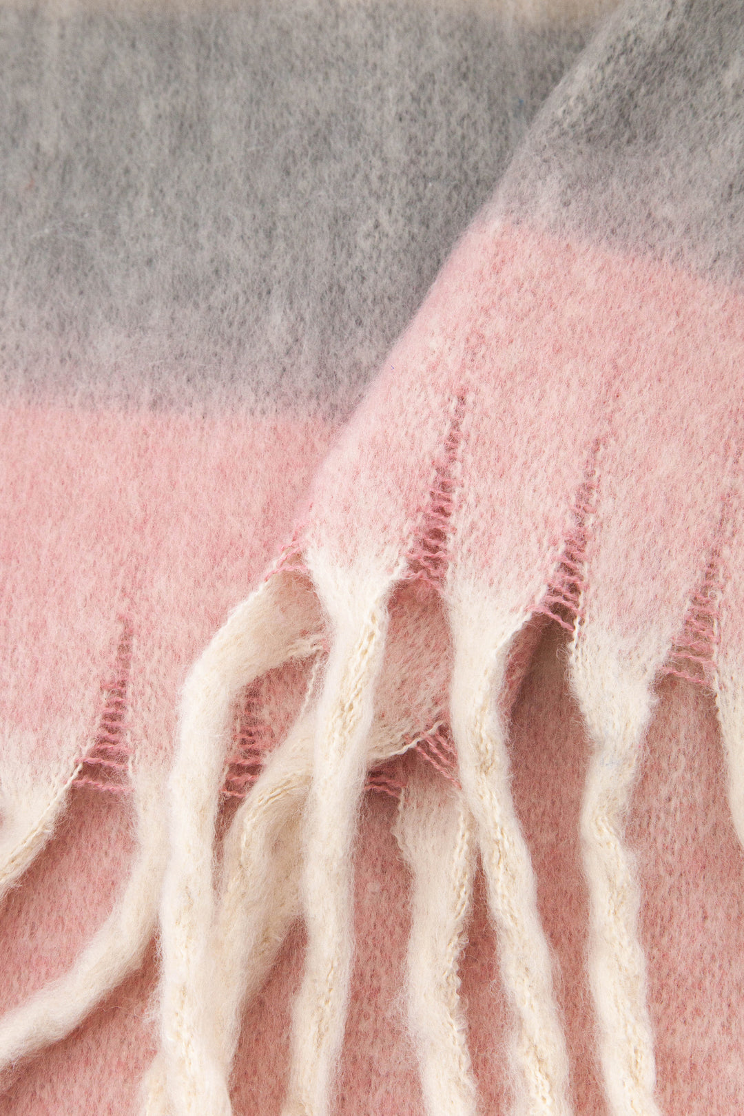 close up of the soft viscose knitted material of the winter blanket scarf