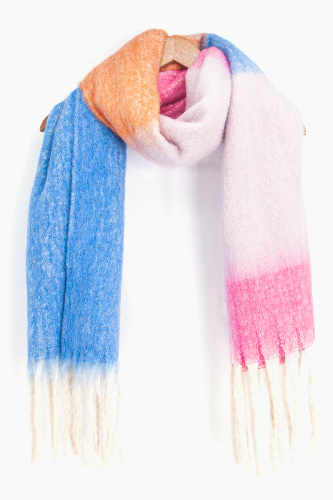 showing the blue and pink colour block winter scarf draped around a coat hanger, showing how it would look when worn.