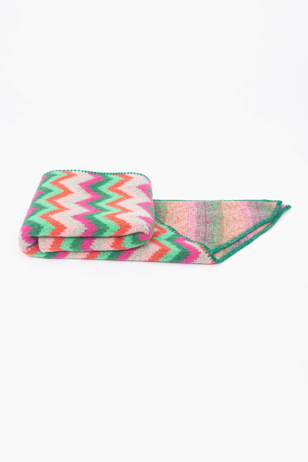 side view of the scarf when folder, showing the texture and thickness of the material. this scarf is warm and winter weight