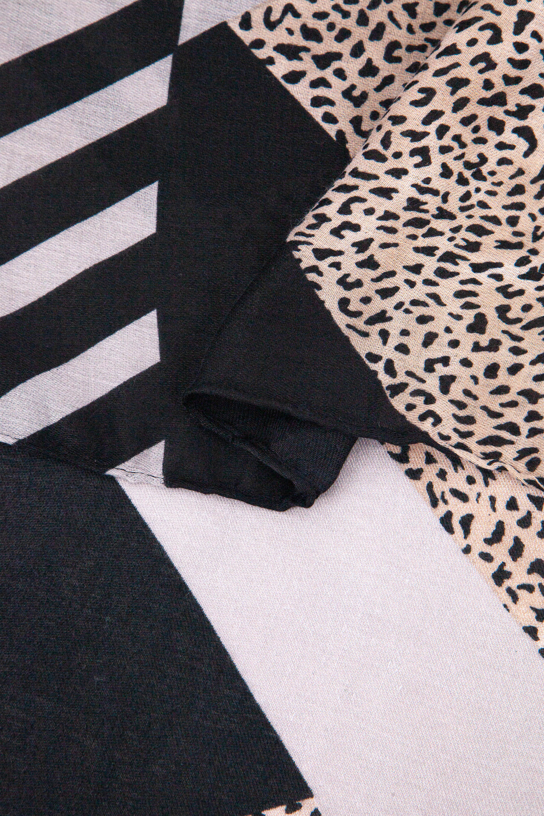 close up of the soft viscose fabric, the contrasting print is clearly visible