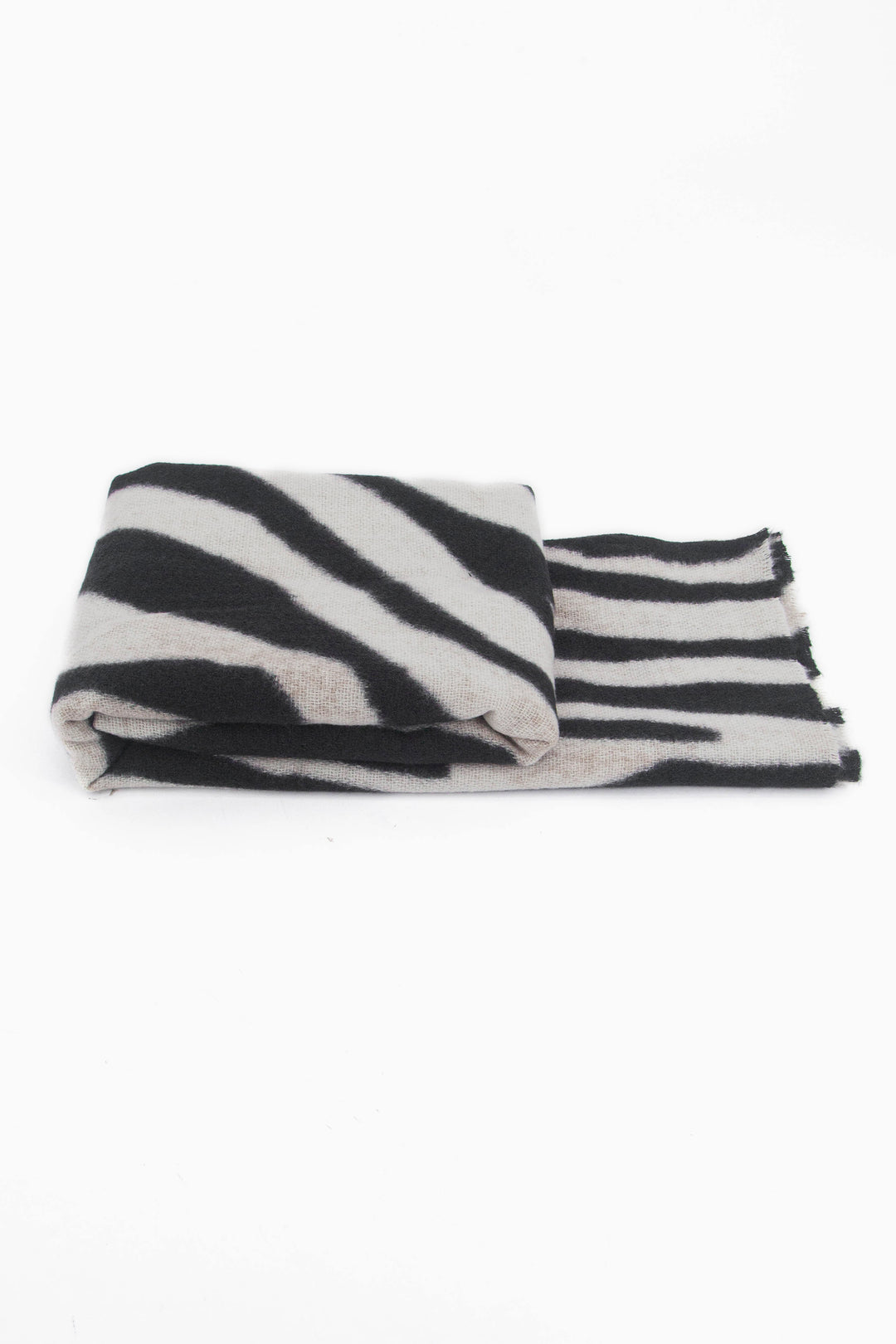 side view of the scarf when folded, showing the texture and thickness of the material. this scarf is lightweight