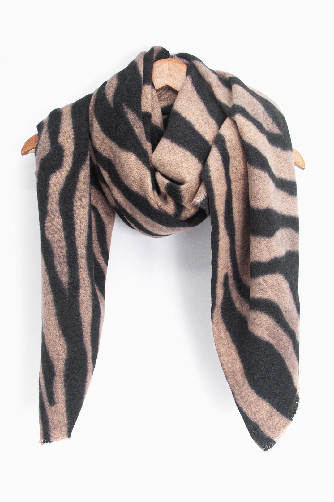 showing the scarf draped around a coat hanger, showing the all over pattern and how it would look when worn