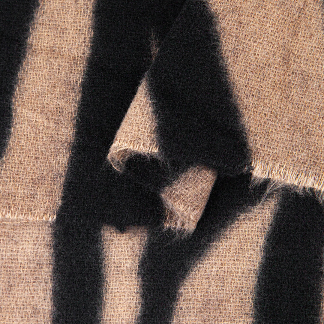 close up of the soft viscose fabric, the neutral and black colourways are clearly visible