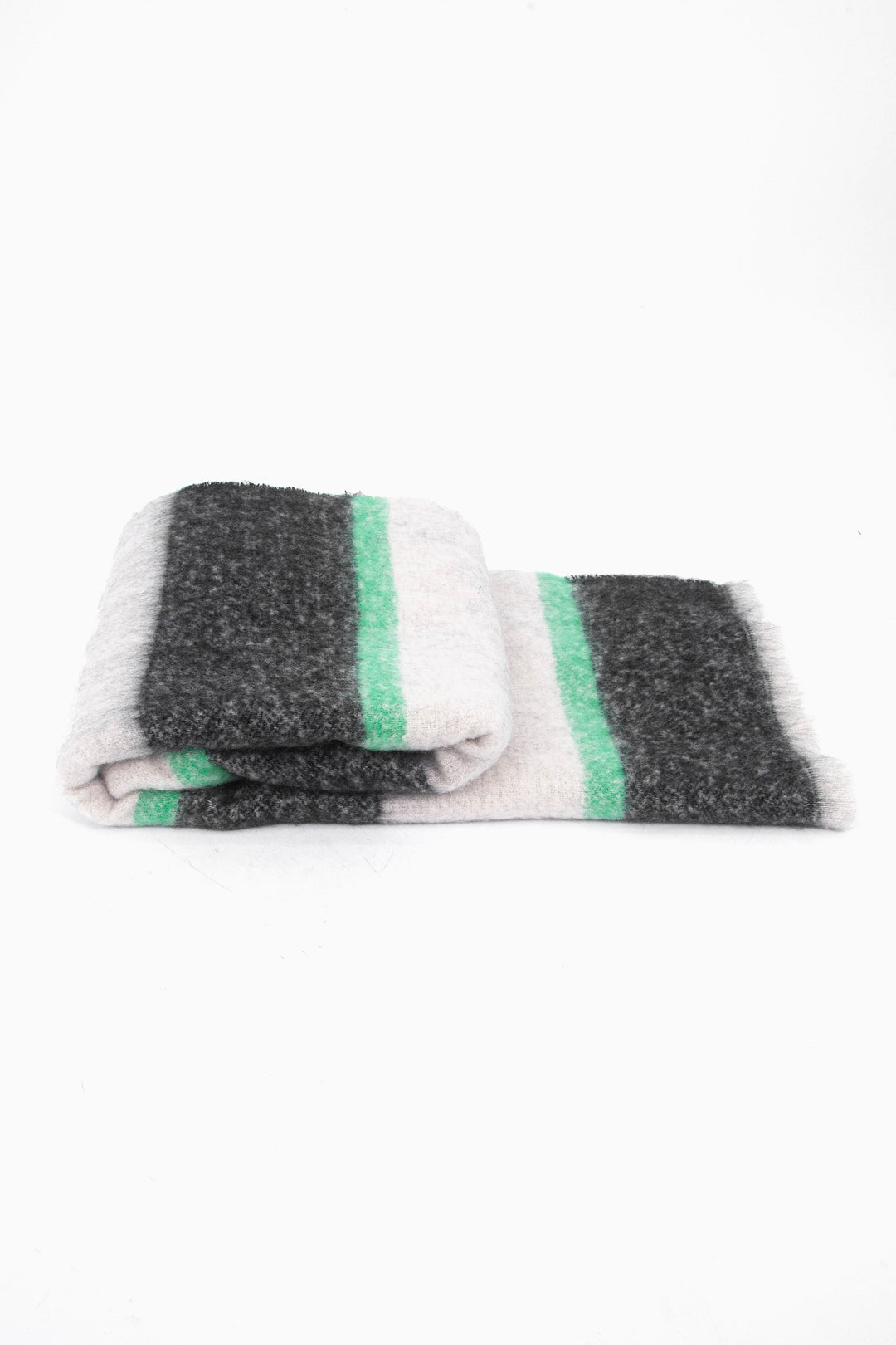 side view of the scarf when folded, showing the texture and thickness of the material. this scarf is midweight
