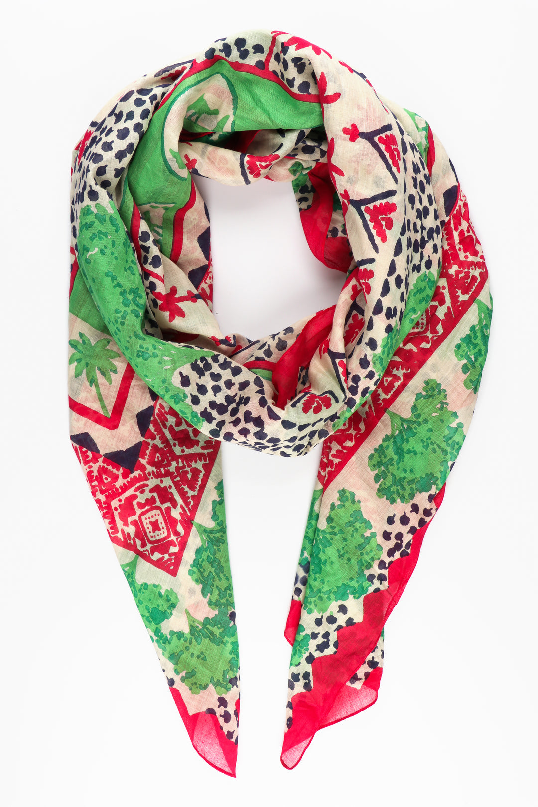 cotton scarf in green and pink with a pattern of palm trees and camels