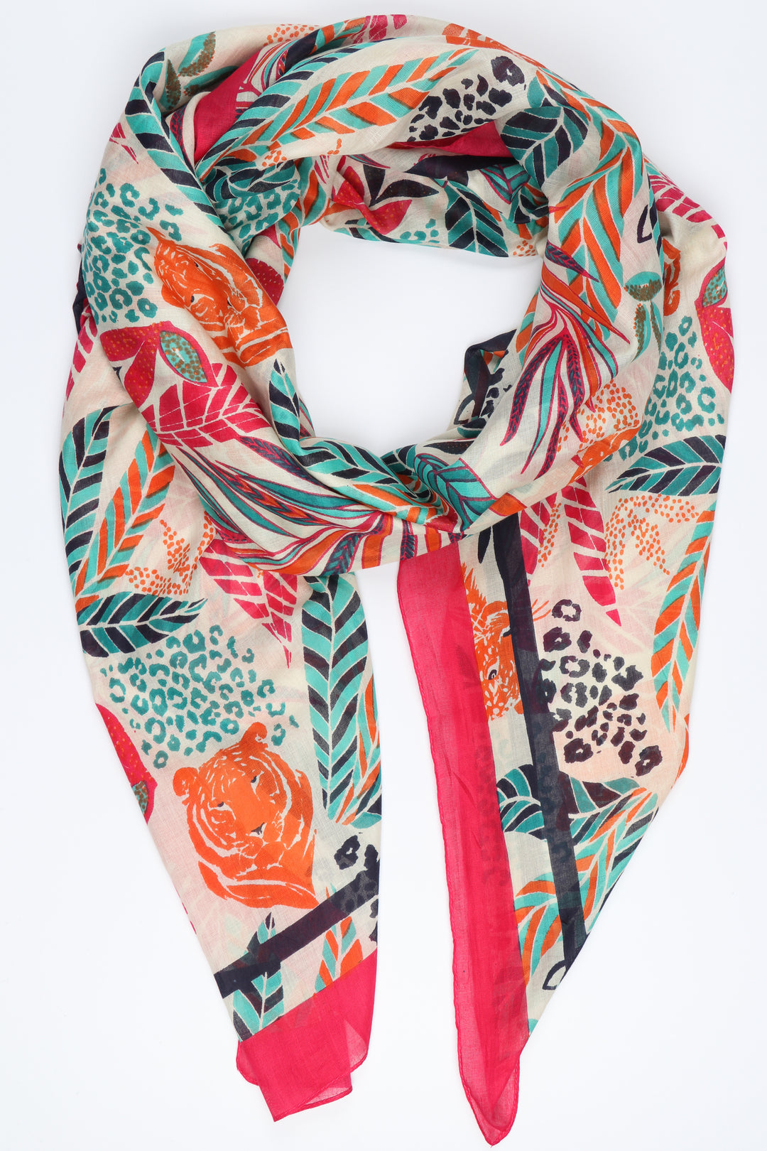 cream, pink, green and orange jungle leaf and tiger head pattern scarf with a pink border 