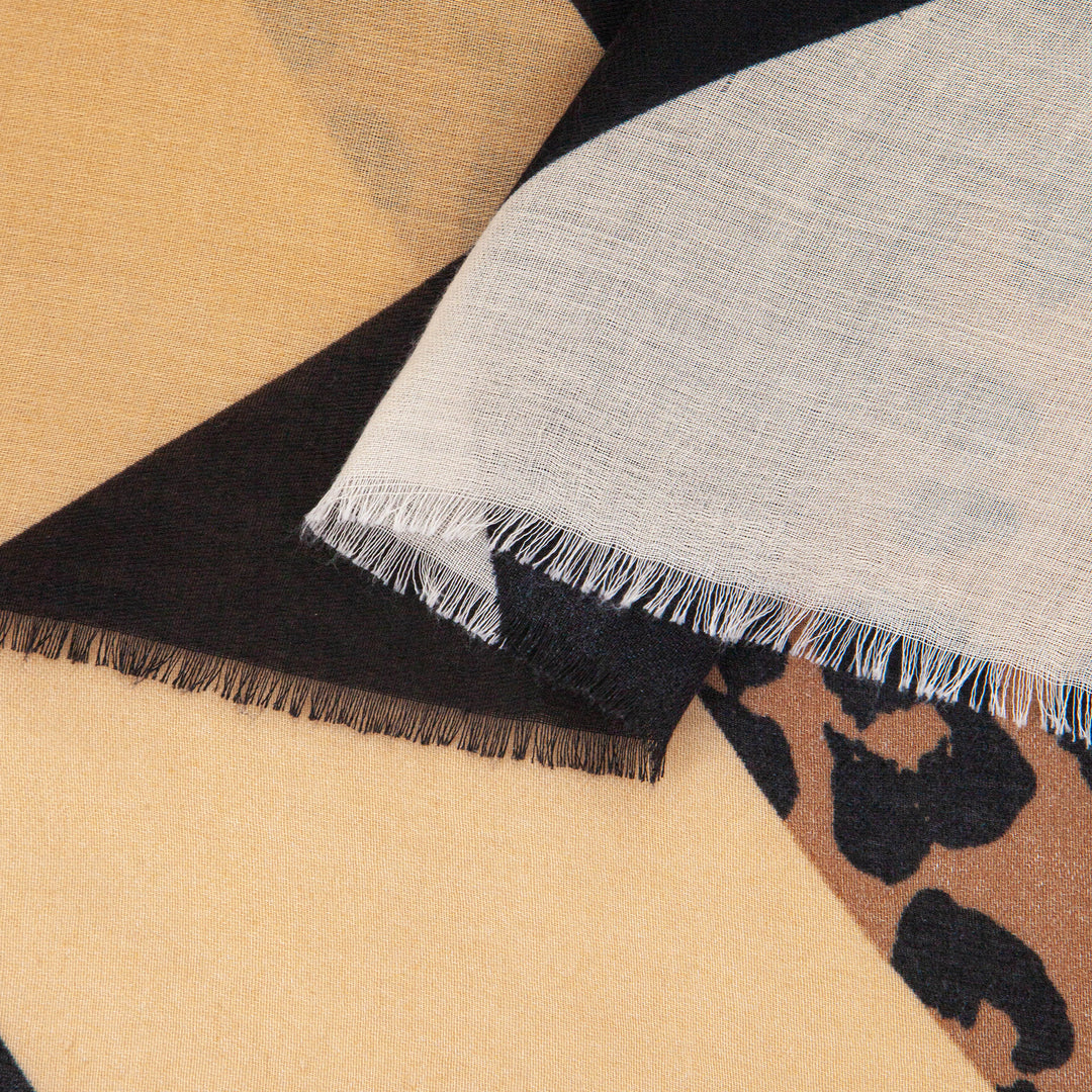close up of the soft viscose fabric, the neutral and black colourways are clearly visible