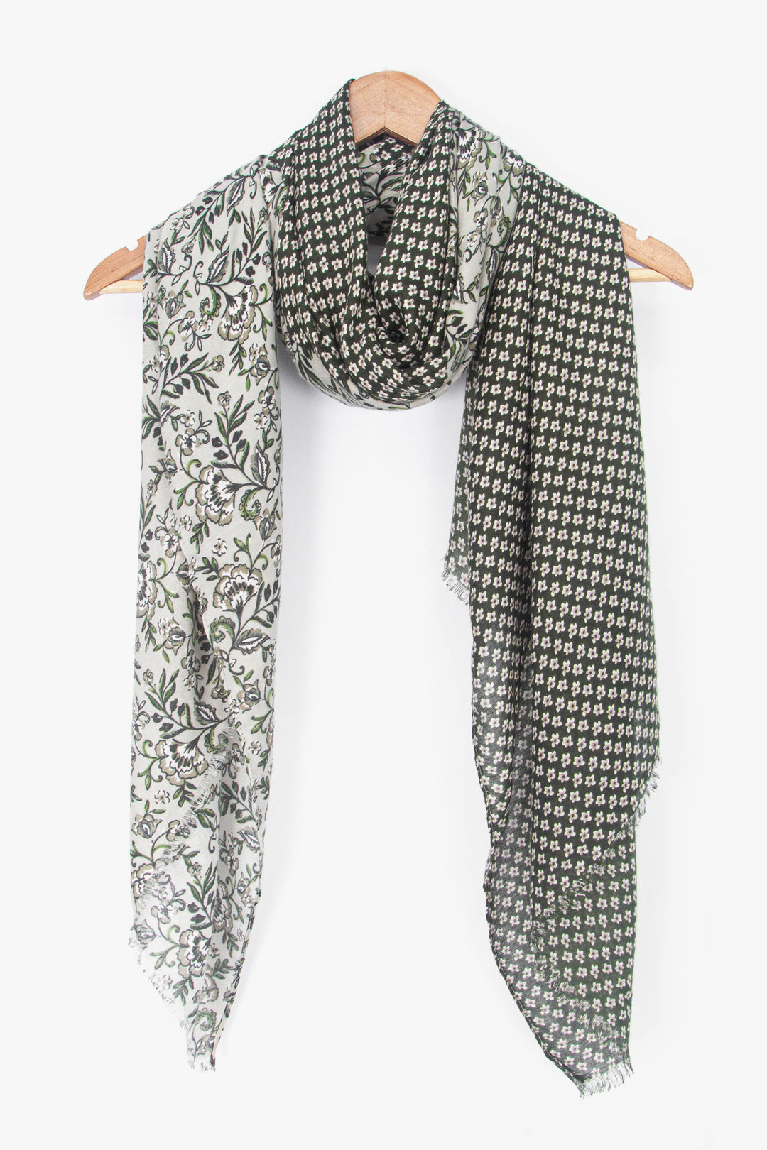 showing the scarf draped around a coat hanger, showing the all over pattern and how it would look when worn