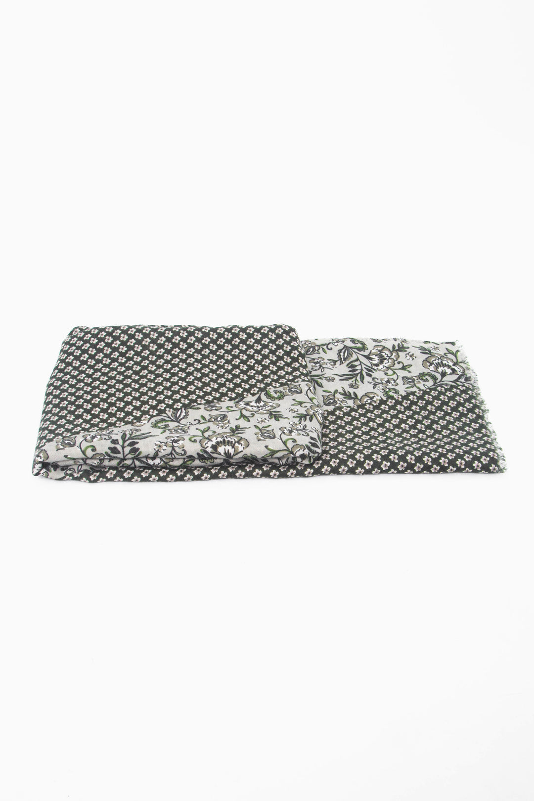 side view of the scarf when folded, showing the texture and thickness of the material. this scarf is lightweight