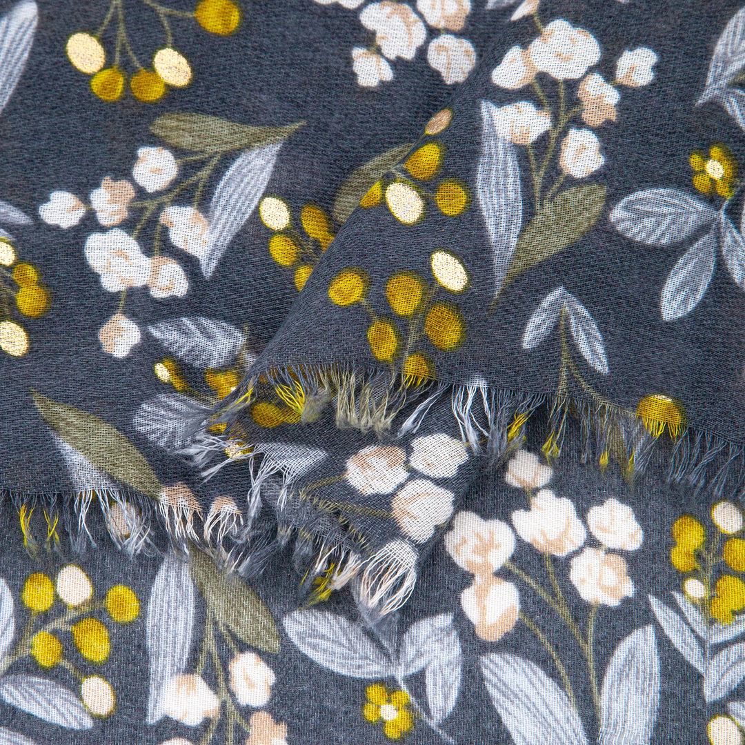 close up of the soft viscose fabric, the grey and yellow colourways and gold foil speckle pattern is clearly shown