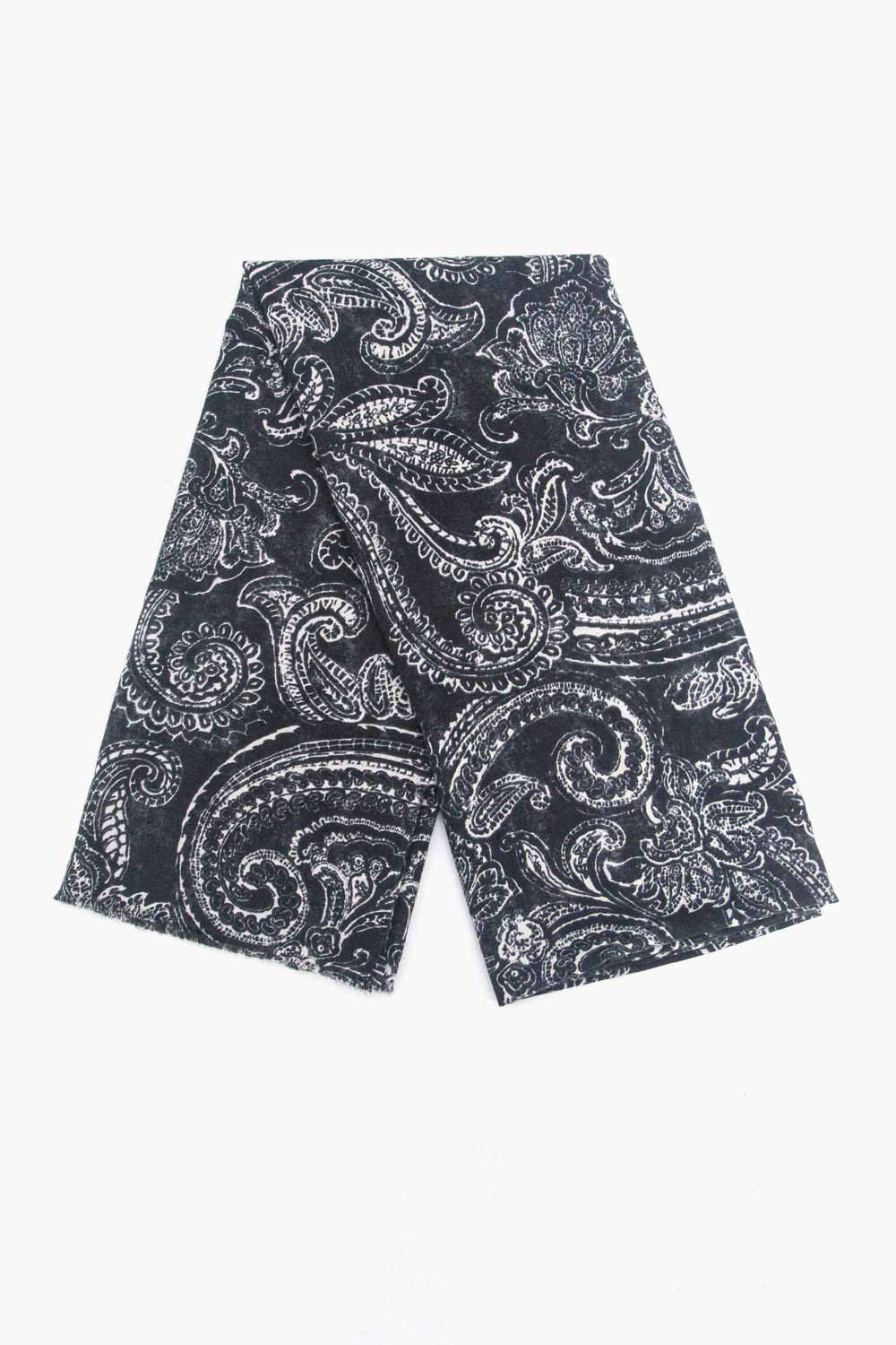 showing the scarf folded, the black and white paisley floral print pattern is shown to cover the whole scarf