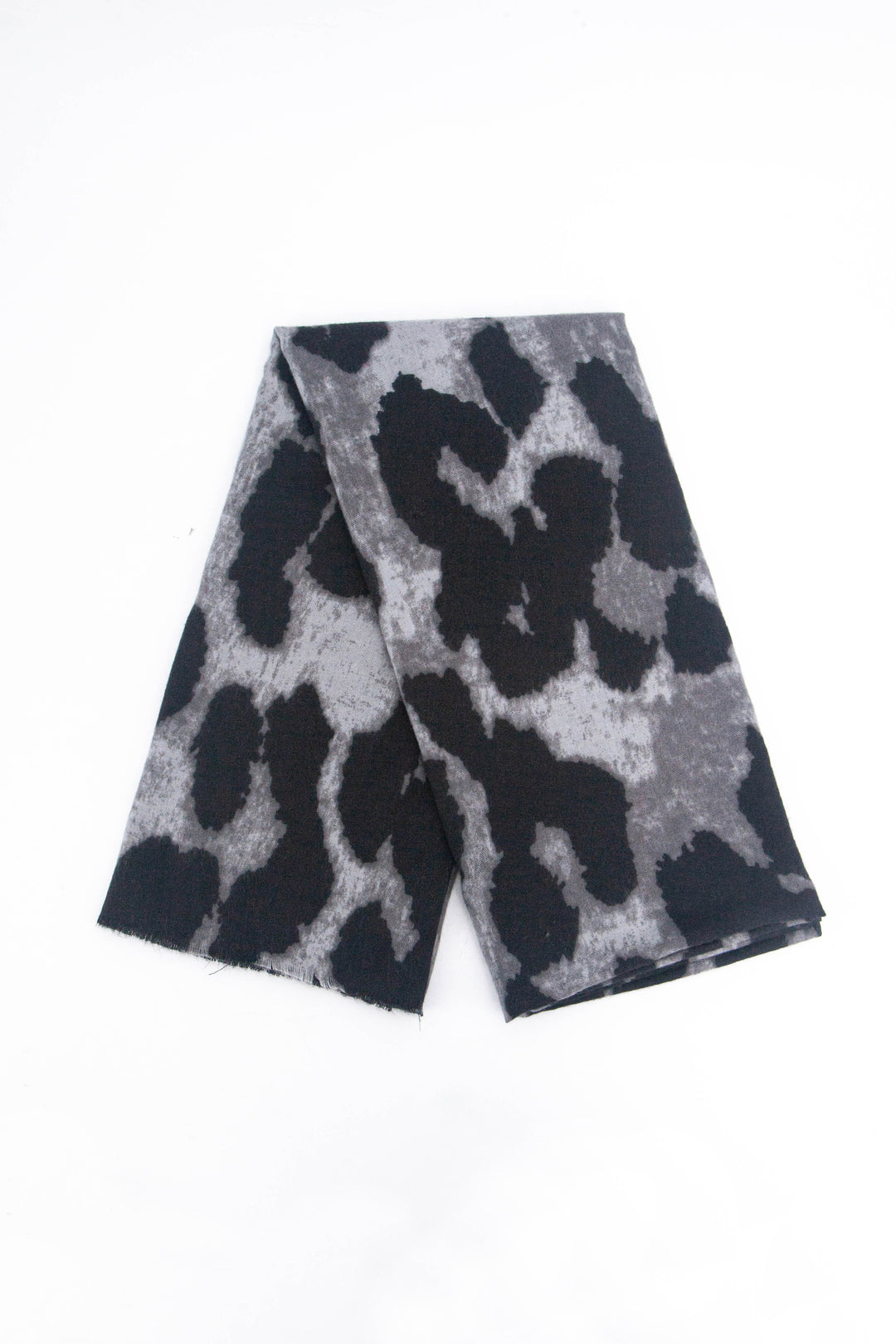 showing the scarf folded, the black and grey large leopard print pattern is shown to cover the whole scarf.