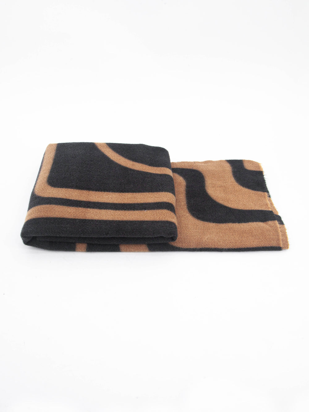 side view of the scarf when folded, showing the texture and thickness of the material. this scarf is midweight