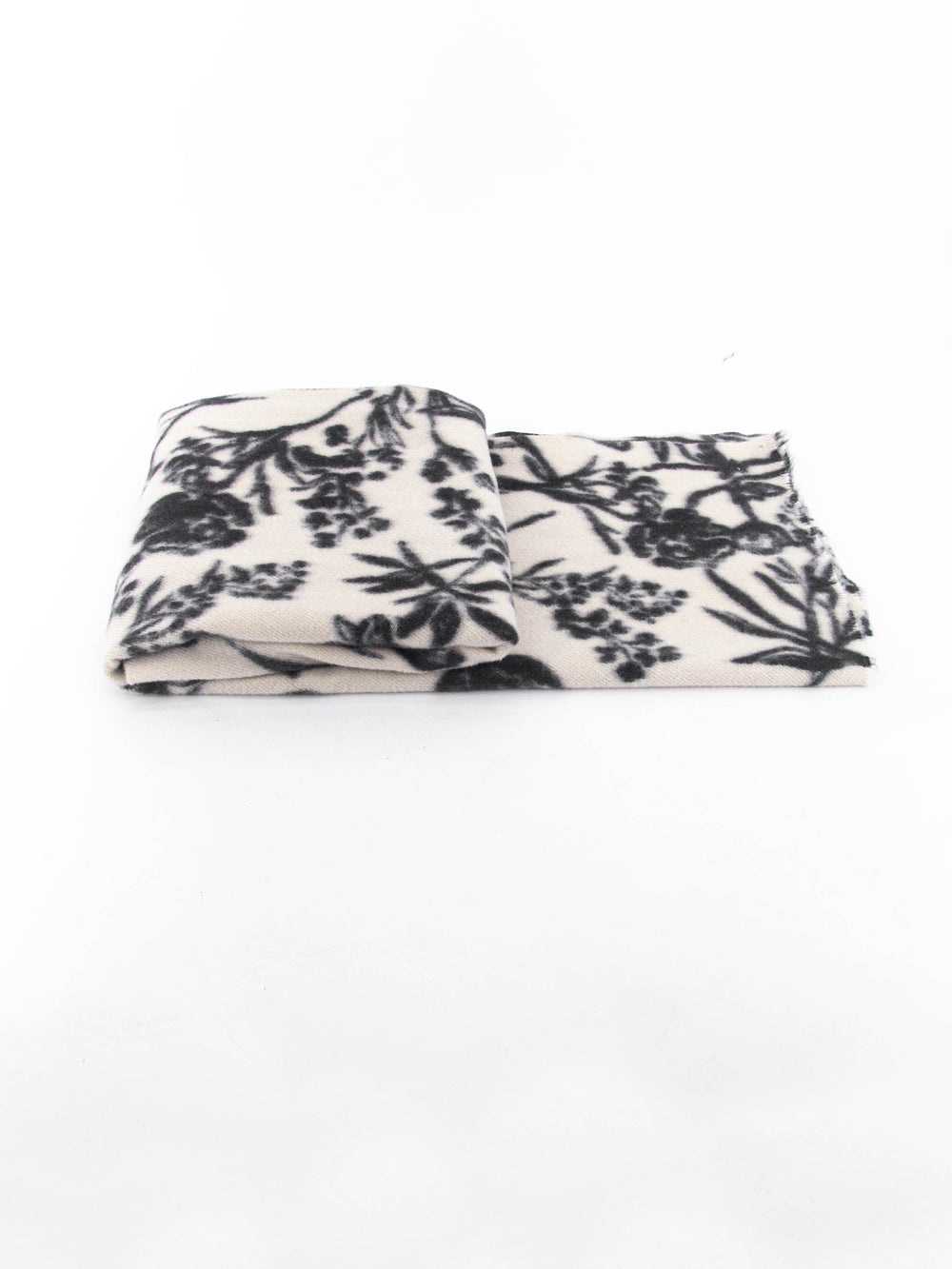 side view of the scarf when folded, showing the texture and thickness of the material. this scarf is midweight