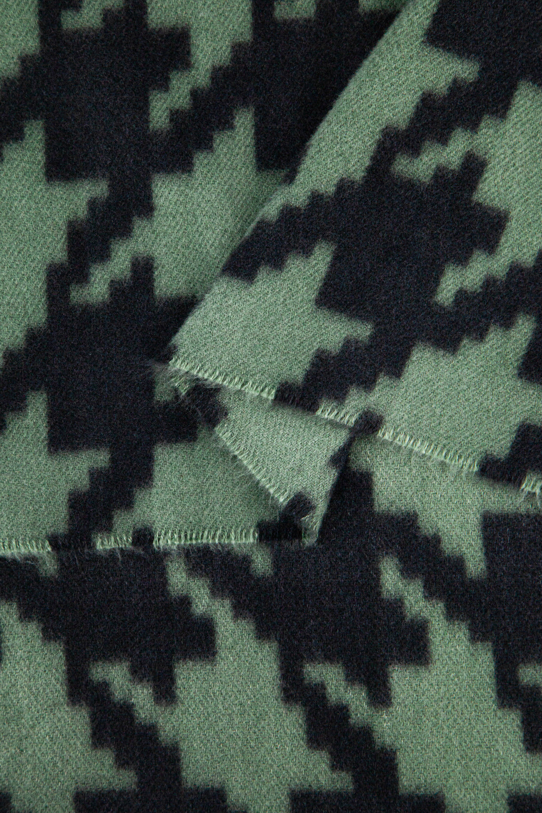 close up of the soft viscose fabric, the khaki and black colourways are clearly visible