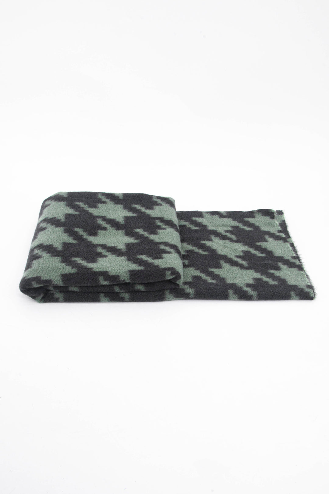 side view of the scarf when folded, showing the texture and thickness of the material. this scarf is midweight