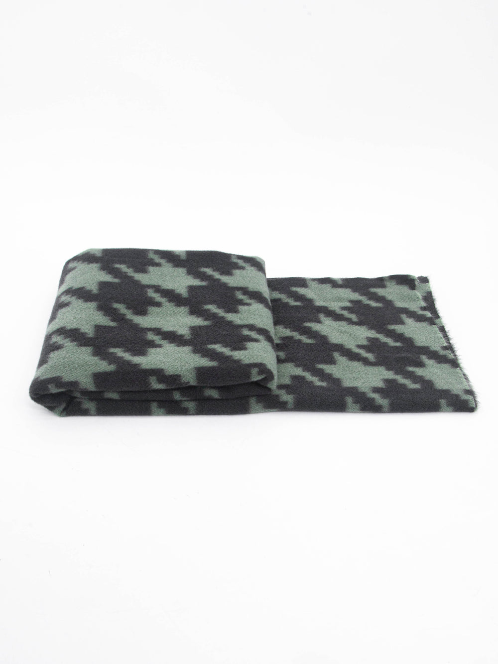 side view of the scarf when folded, showing the texture and thickness of the material. this scarf is midweight