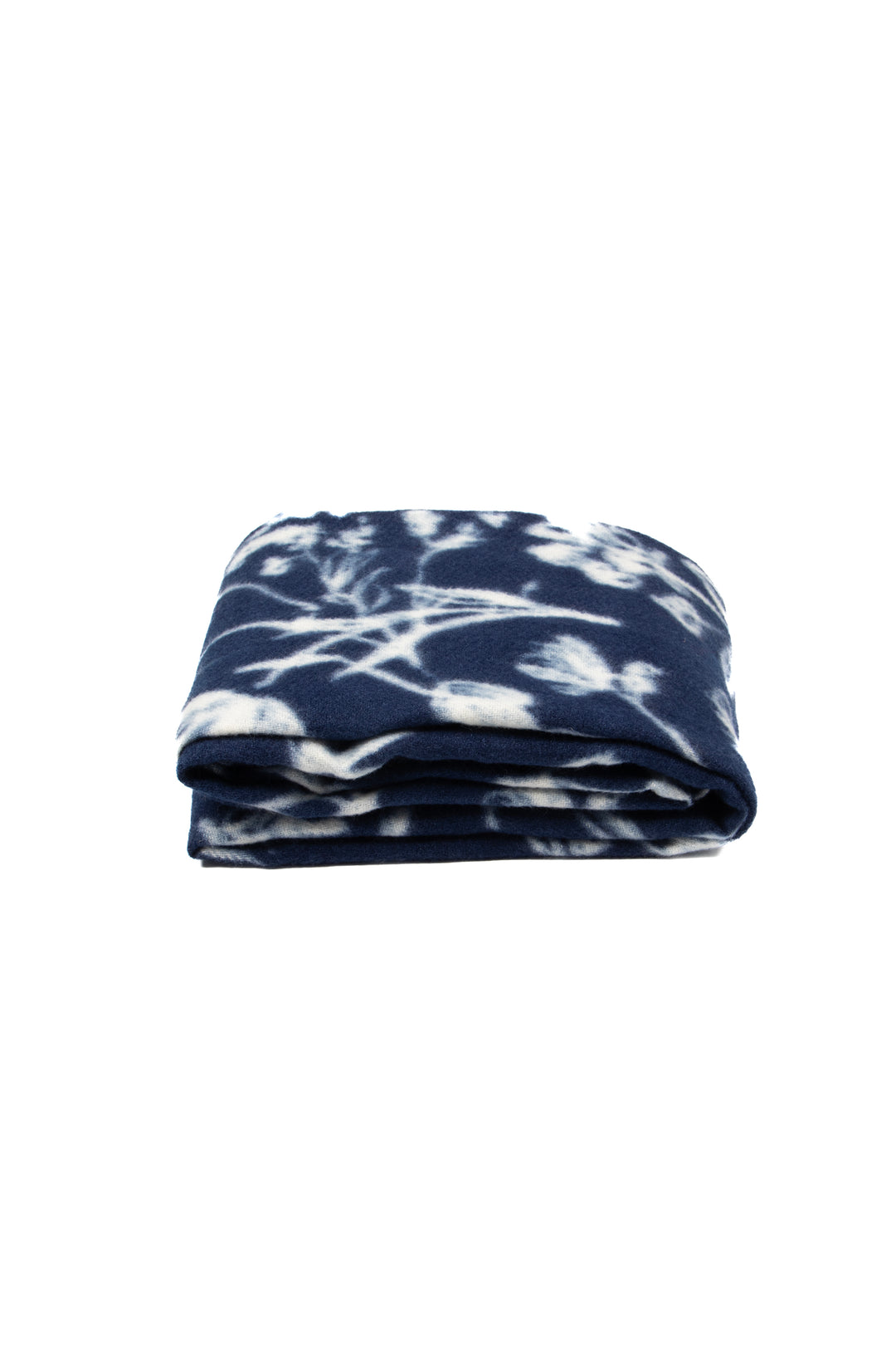 side view of the scarf when folded, showing the texture and thickness of the material. this scarf is midweight