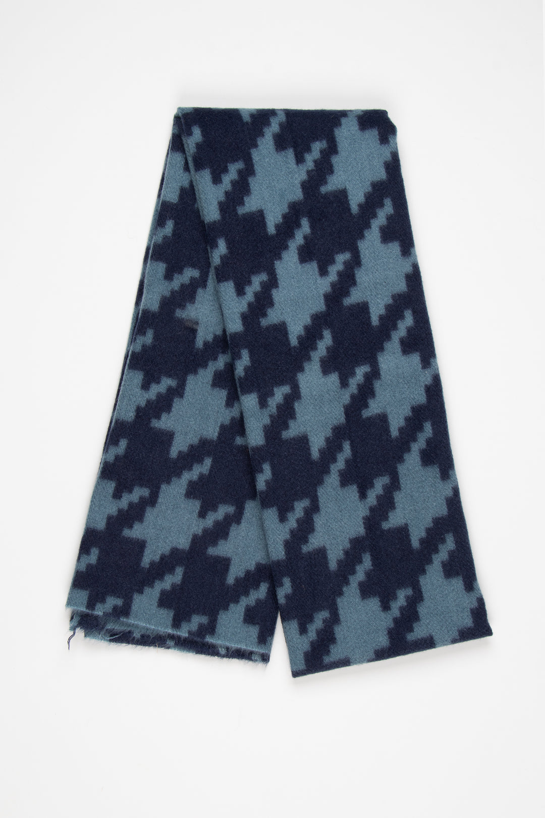 showing the scarf folded, the navy blue and teal houndstooth pattern is shown to cover the whole design