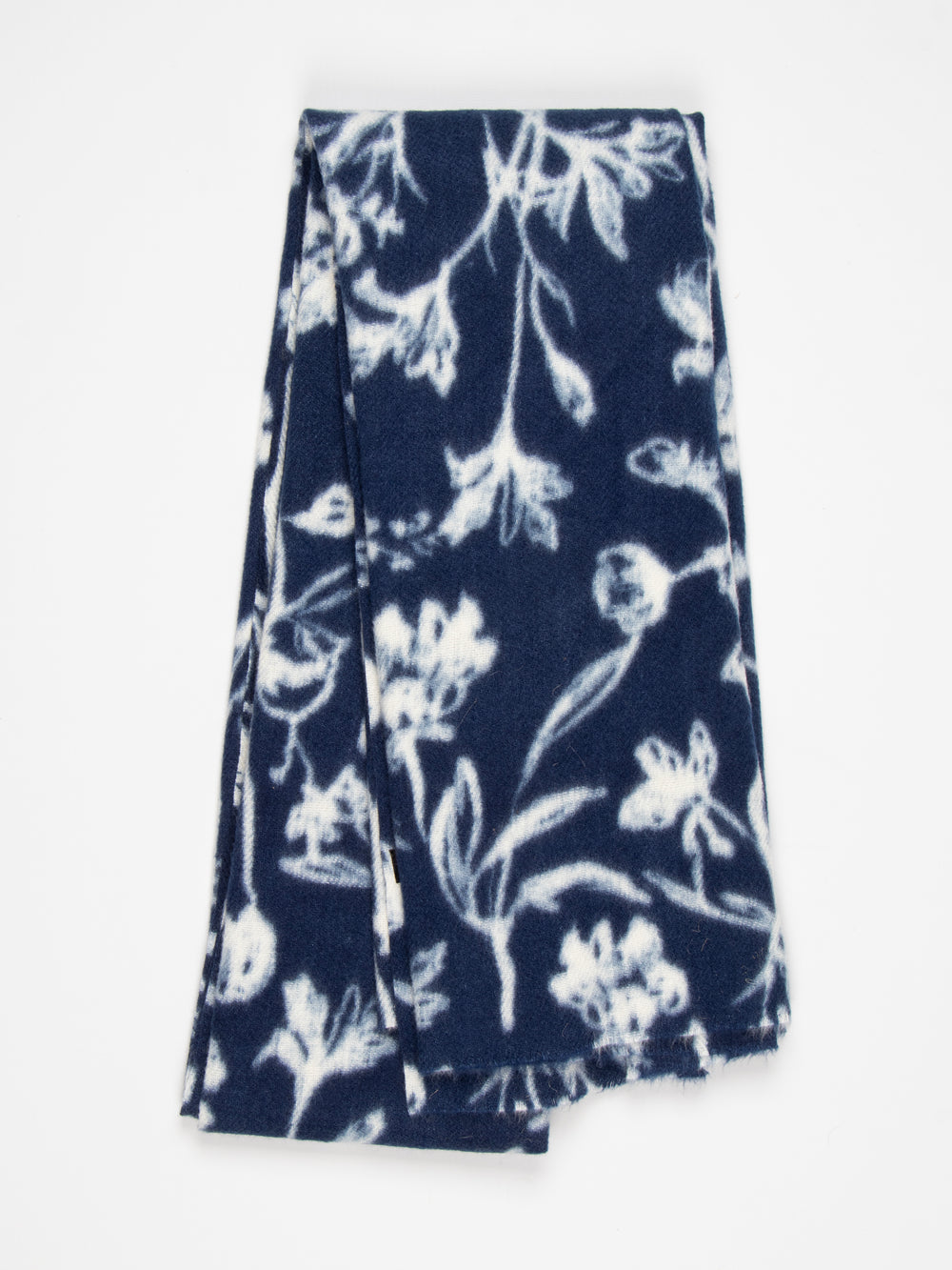 showing the scarf folded, the navy blue and white floral pattern is shown to cover the whole design