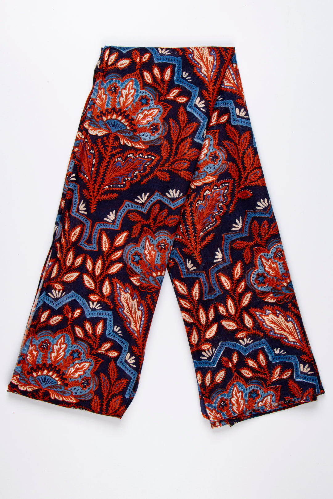 showing the scarf folded, the blue and coral floral mosaic pattern is clearly shown and covers the entire scarf.
