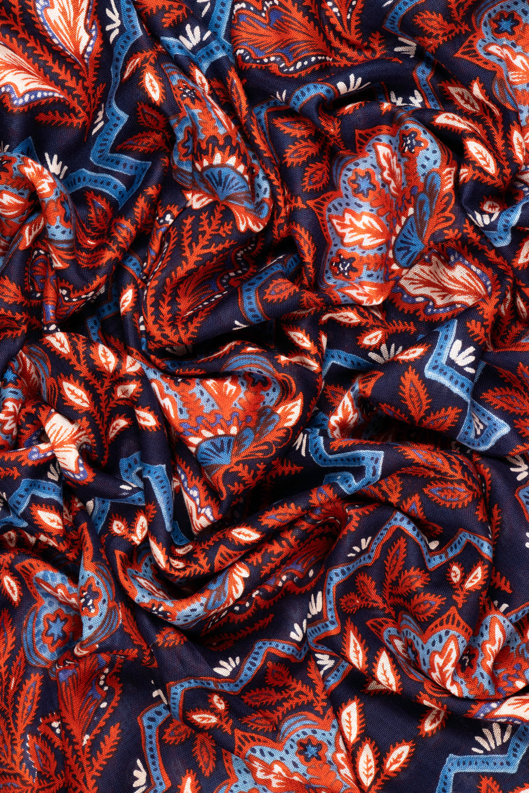 close up of the soft viscose fabric, the blue and coral colourways are clearly visible