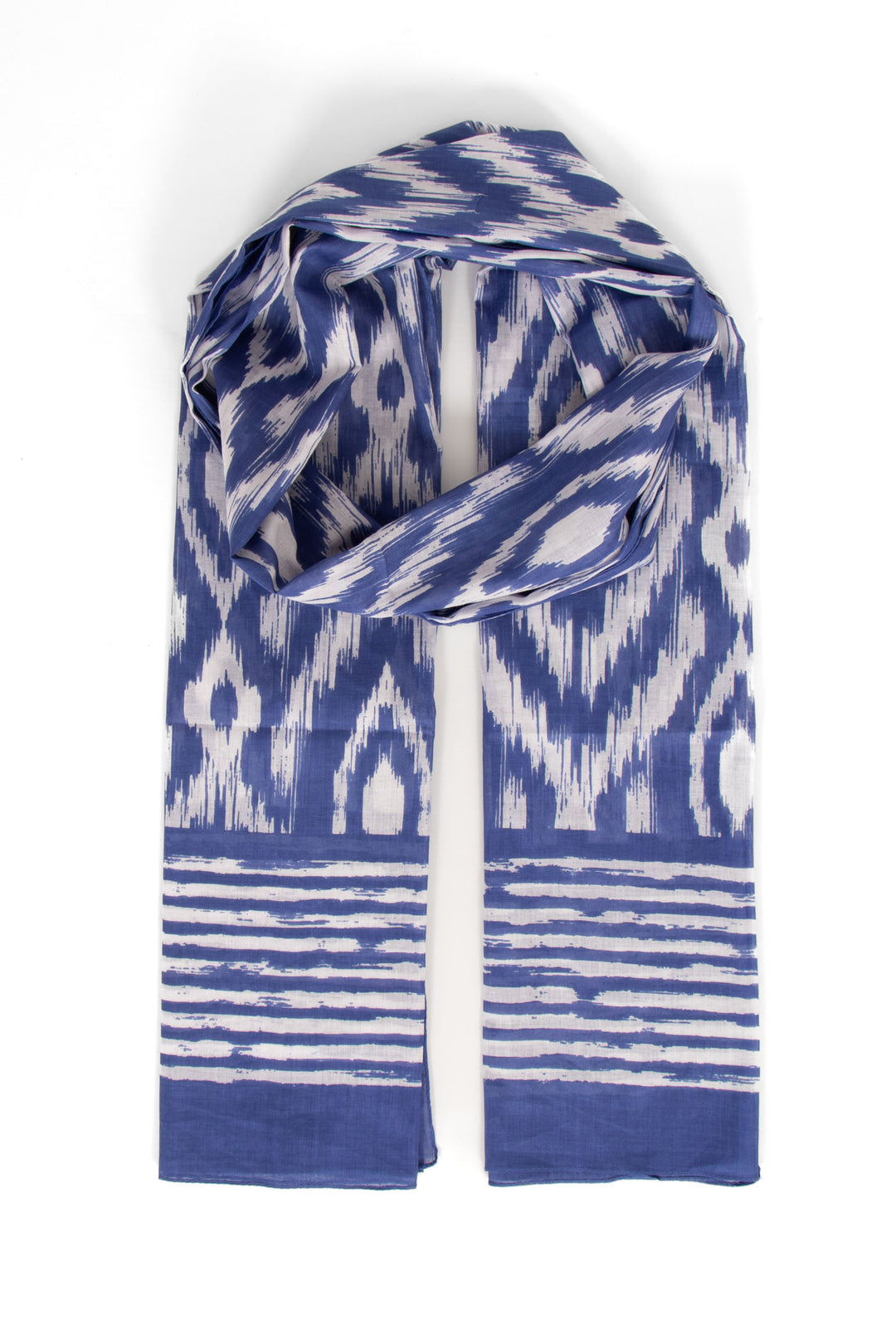 blue cotton lightweight aztec scarf. the scarf has an all over pattern and a large bordered edge.