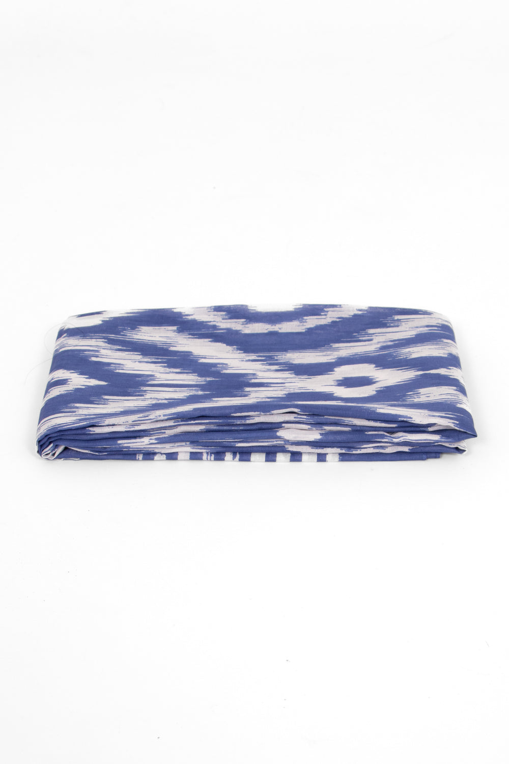 side view of the scarf when folded, showing the texture and thickness of the material. this scarf is lightweight