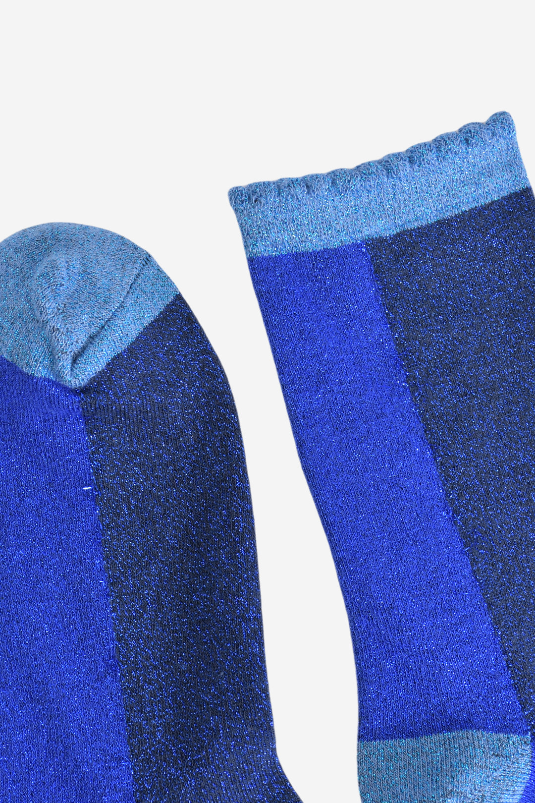 close up of the toe and cuff, both are light blue with glitter sparkles, the cuff has a frilled scalloped edge
