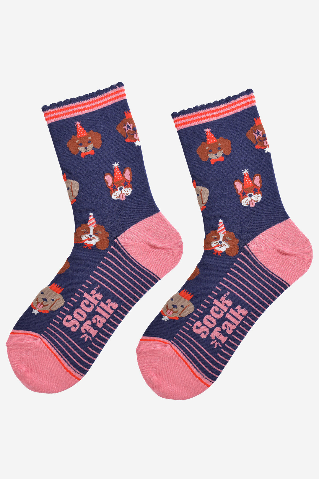 showing the socks laying flat, the soles have pink stripes, the toe and heel are pink and the party dog pattern is all over the design