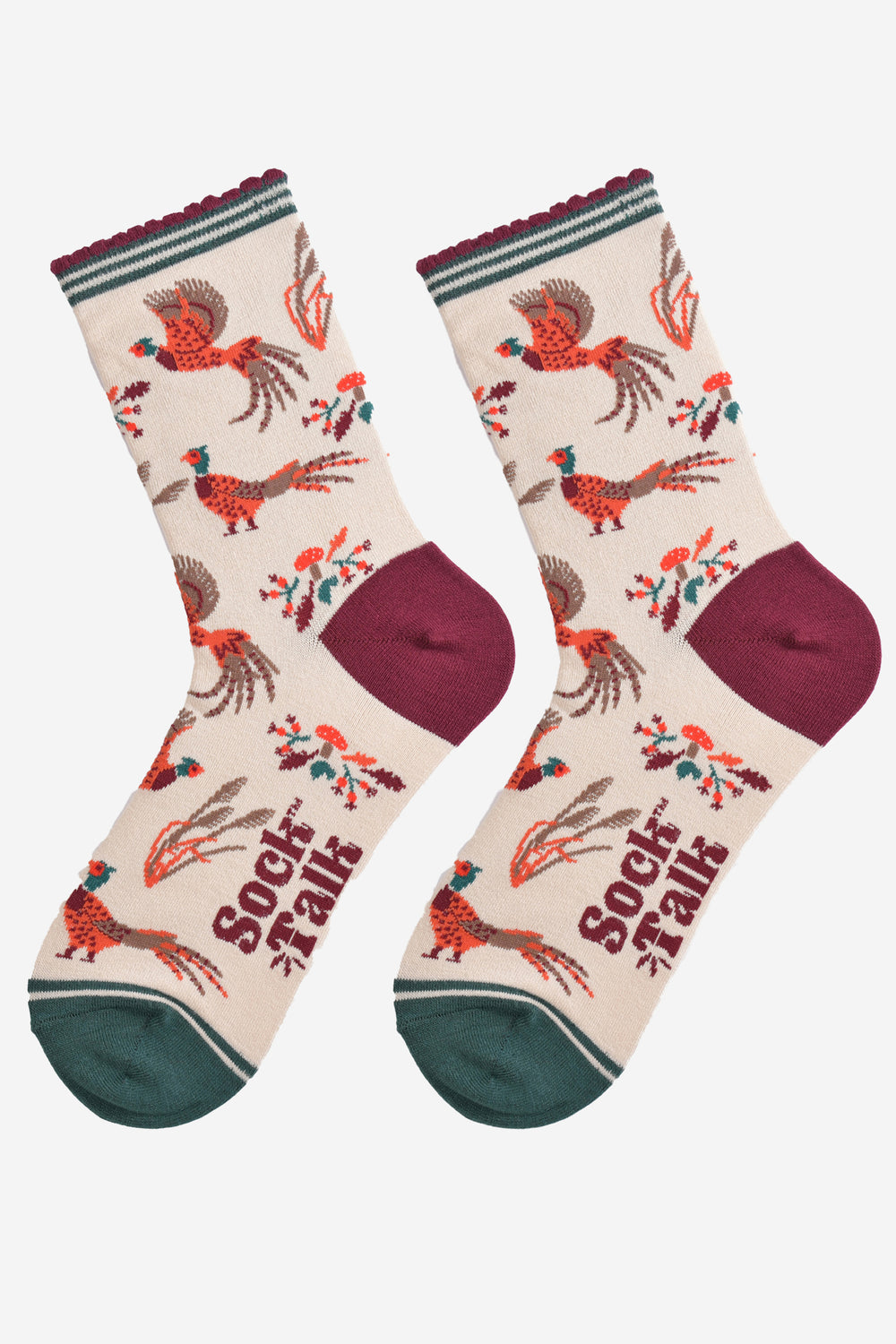 cream woodland pheasant socks laying flat, showing the all over pattern, the birds are in both walking and fluttering in flight