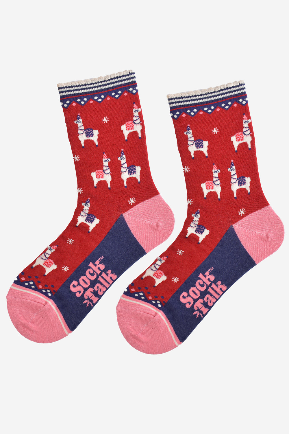 showing the socks laying flat, the sole is navy blue in contrast to the red base of the socks, the socks have llamas and white starbursts all over