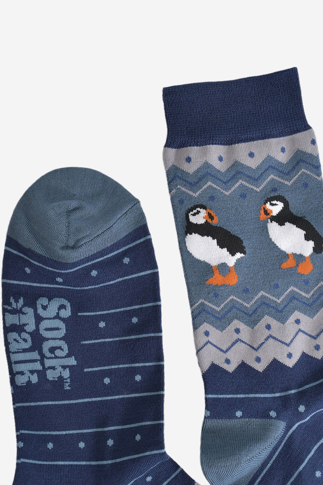showing the cuff and the toe of the bamboo socks, showing up close the fair isle pattern with runs throughout the design
