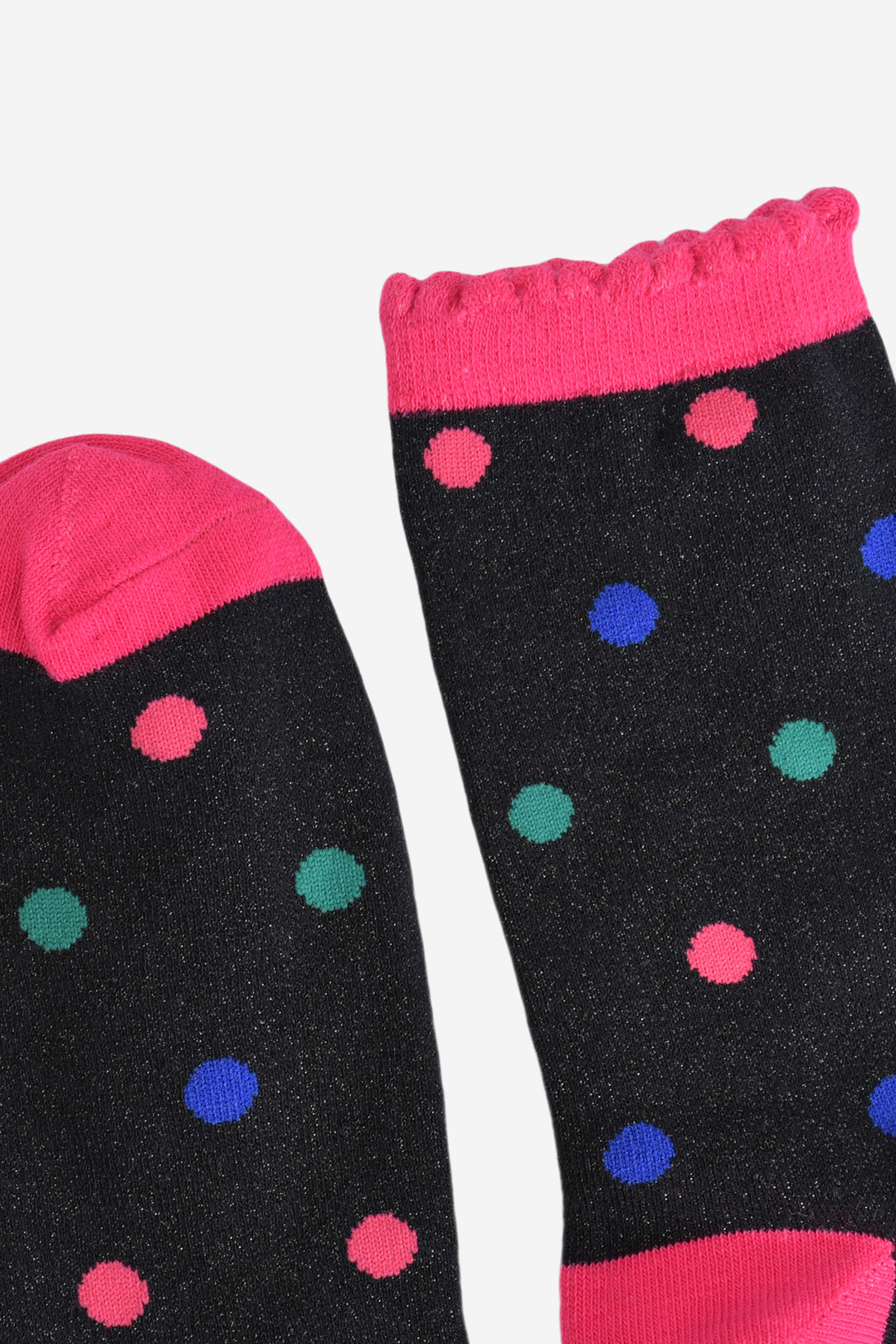close up of the toe and cuff of the socks the toe is hot pink, the cuff is hot pink with a frilled scalloped edge