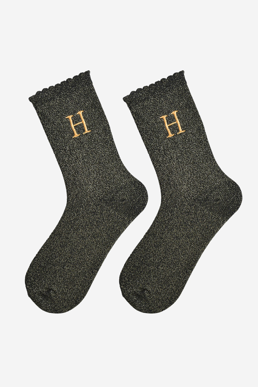 showing the glitter socks laying flat, they have a scalloped cuff and an all over gold sparkle