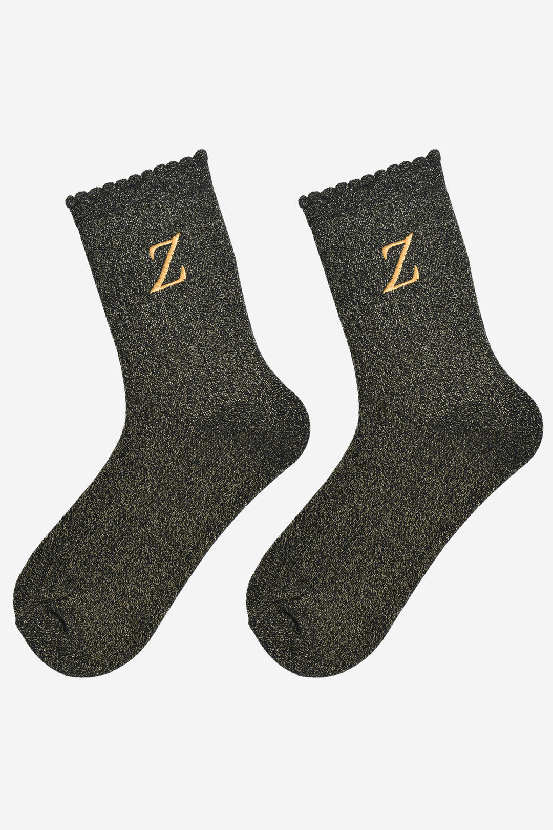showing the glitter socks laying flat, they have a scalloped cuff and an all over gold sparkle