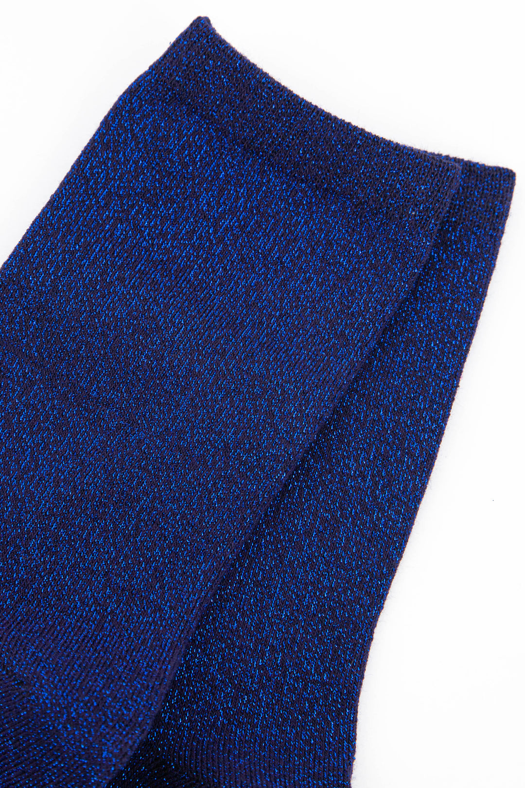 close up of the blue sparkly ankle socks showing the all over glitter effect of the material