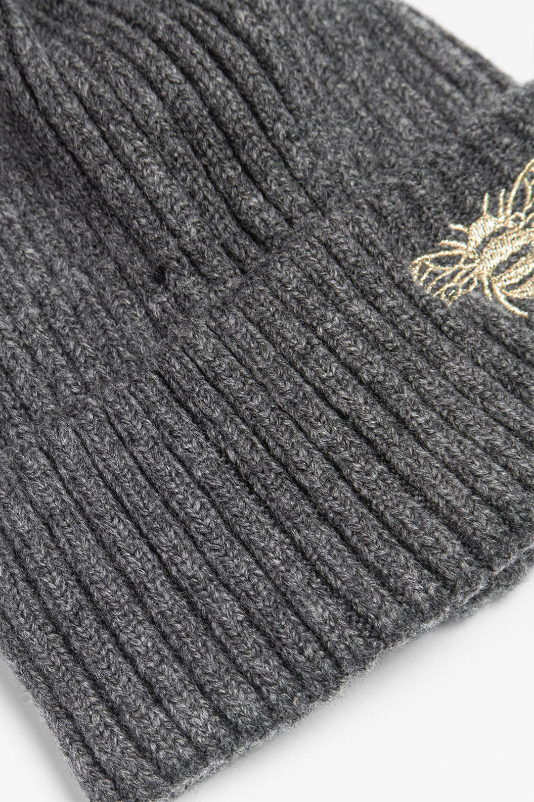 close up of the ribbed material of the beanie hat