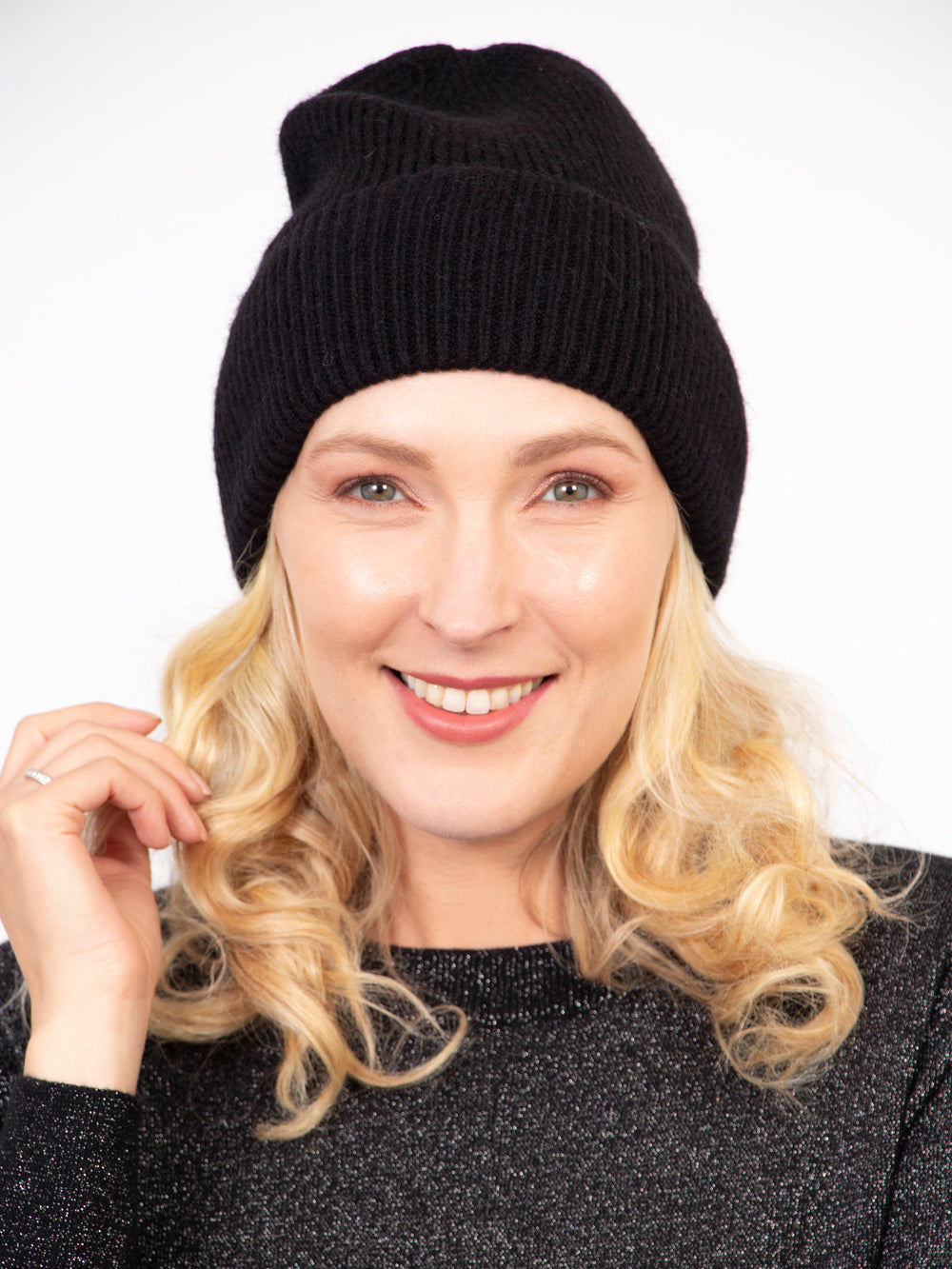 model wearing a plain black winter beanie hat