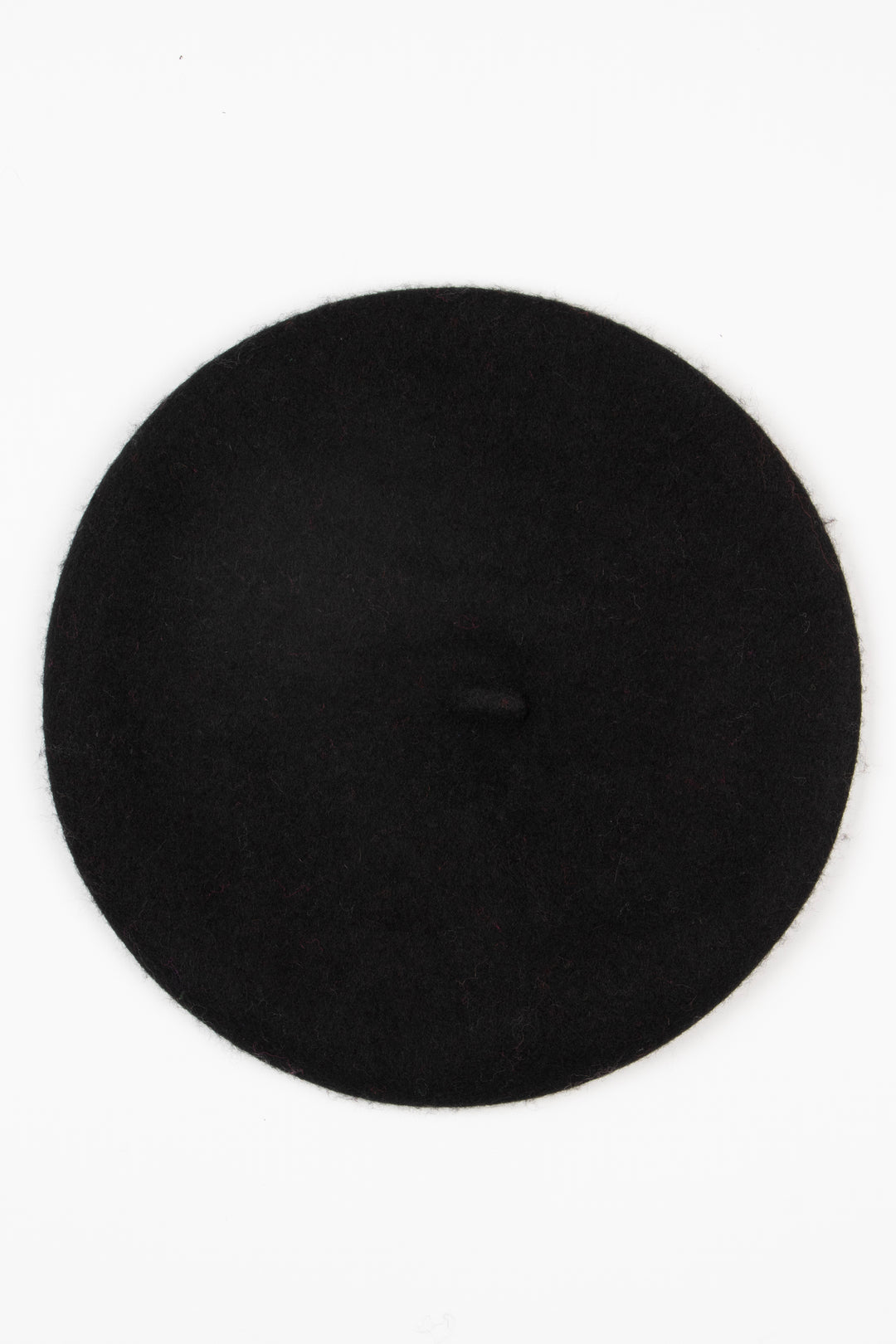 showing the beret hat from above showing the classic stem feature on the top of the hat.