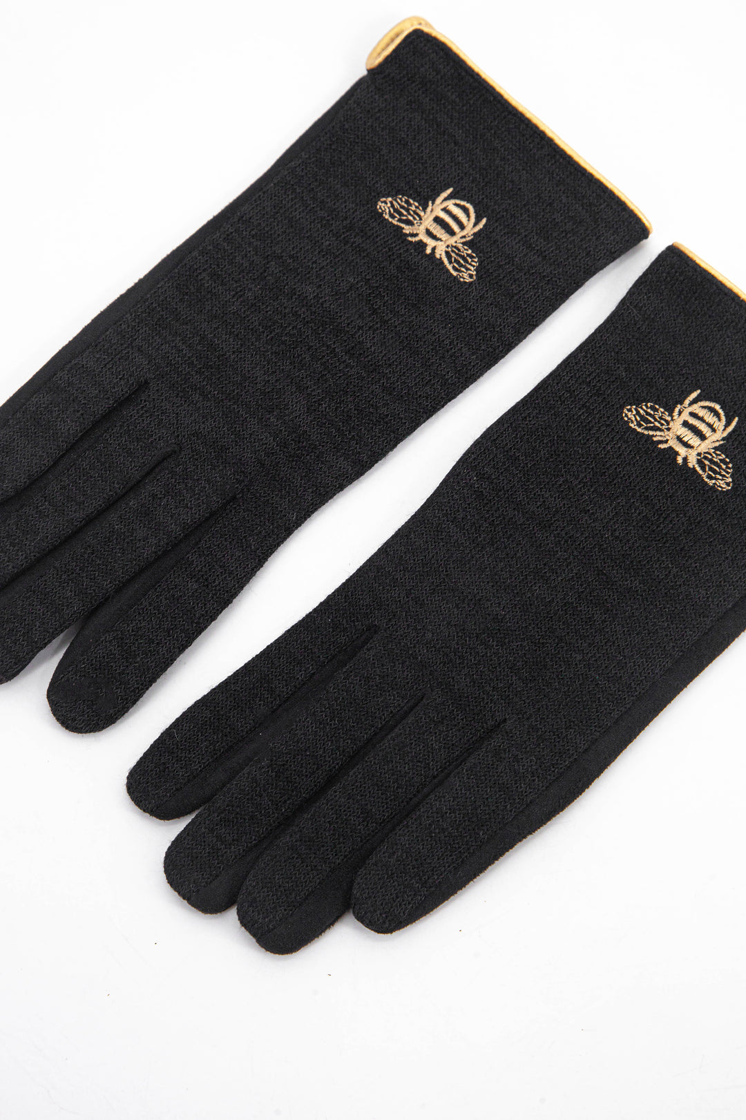 black winter gloves with a gold embroidered bee motif on the back of the wrist.