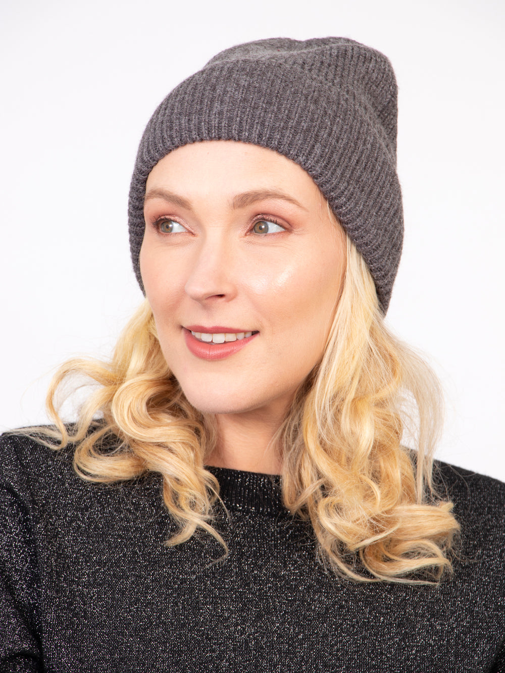 model wearing a ribbed dark grey knitted beanie hat with an all over silver glitter sparkle
