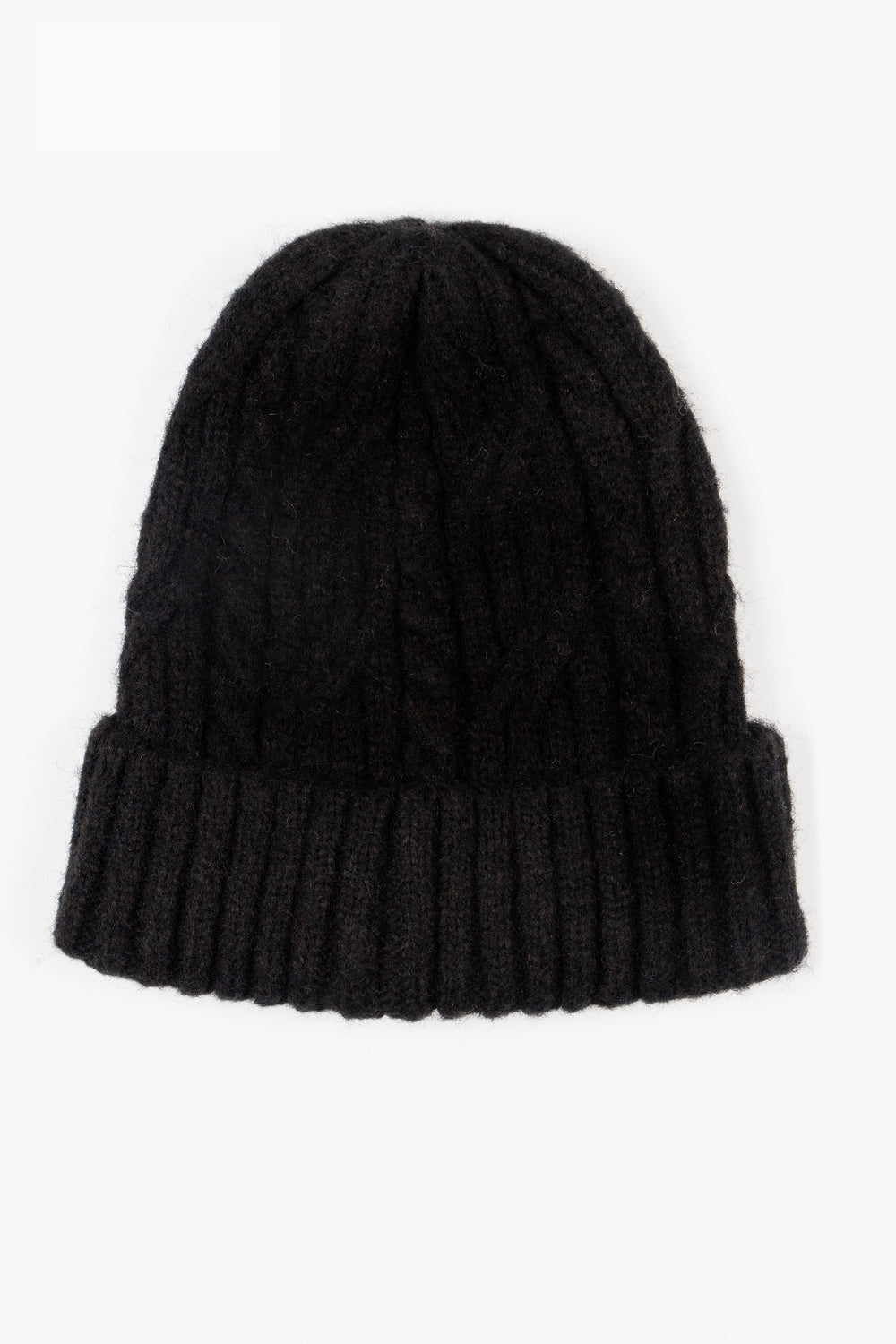 showing the black beanie hat laying flat, the bold cable knit design is shown, the hat also has a ribbed brim.