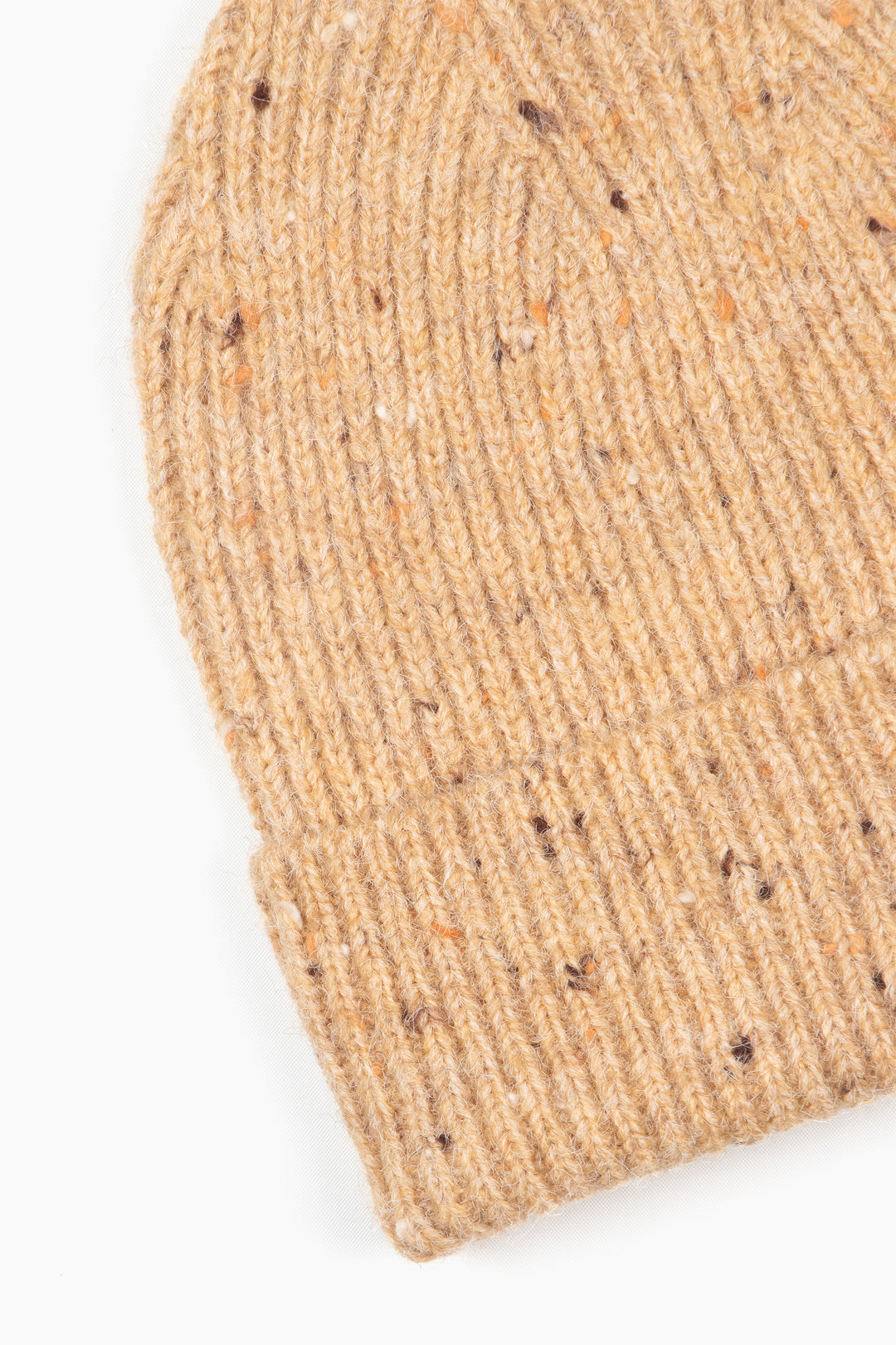 close up of the marl knit beanie hat, showing close up of the knitted fabric and the brim.